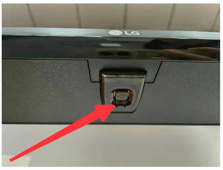 locate the power button on the LG TV