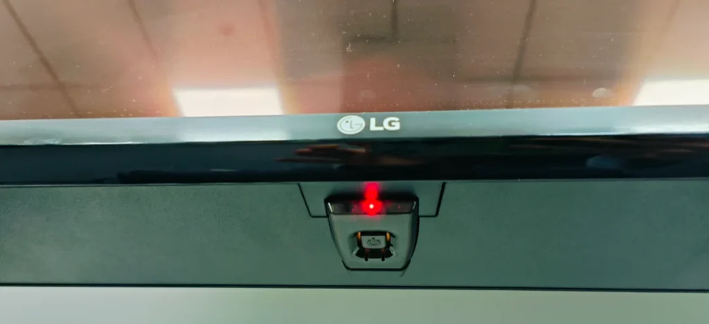 locate the power button on the LG TV